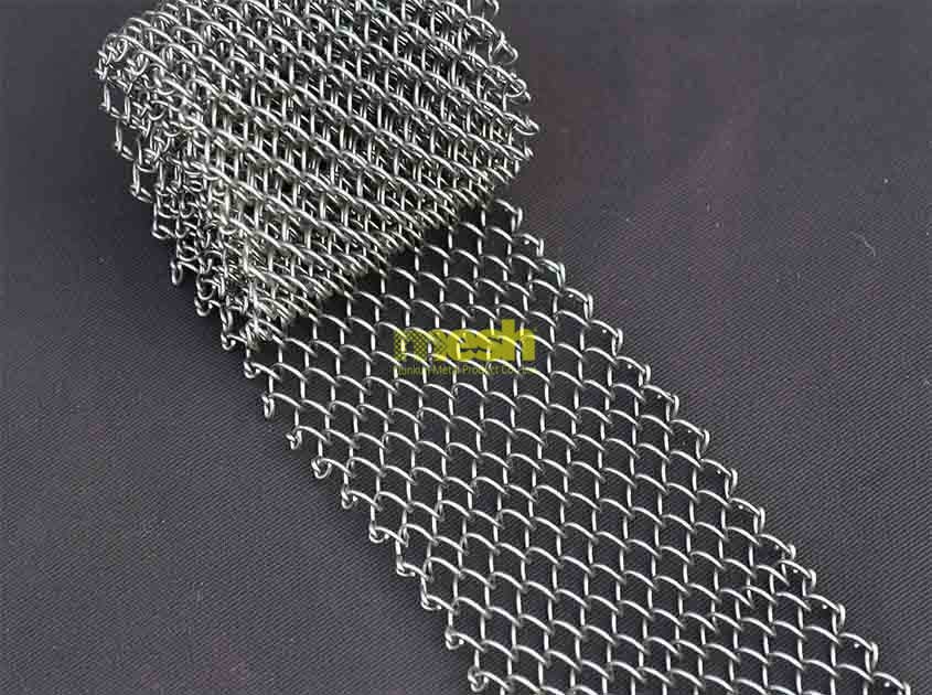 How does Metal Coil Drapery contribute to the acoustics in large venues